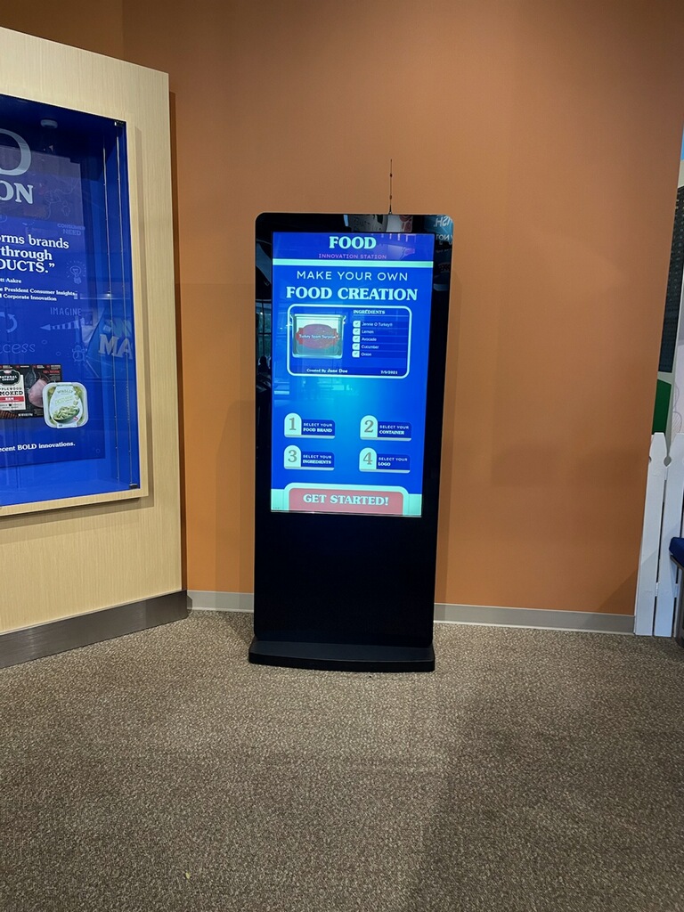 Countertop touchscreen kiosk for a build-your-own food innovation exhibit station at the SPAM Museum.