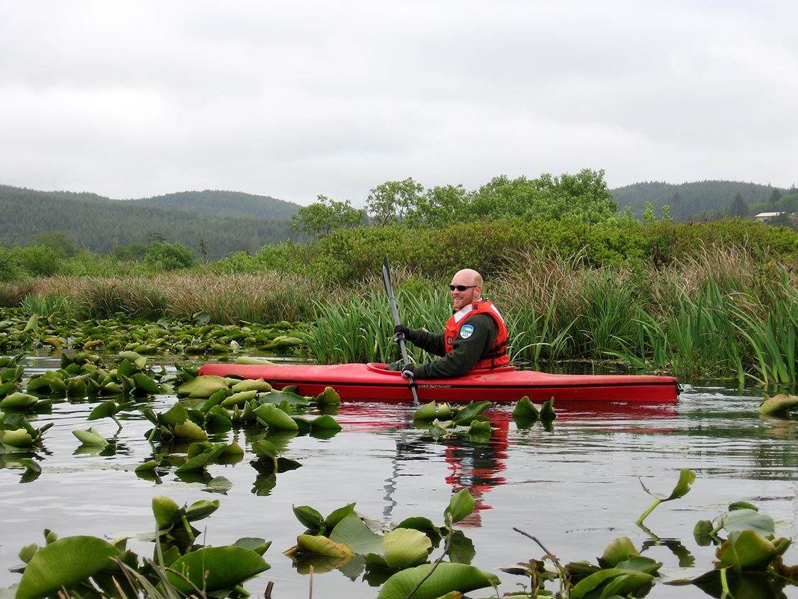 Kayaking among water lilies in Lincoln City
